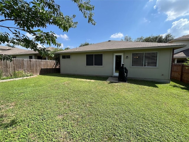 1032 Stacias Way, Pflugerville, TX 78660 - rear view of property featuring stucco siding and roof with shingles