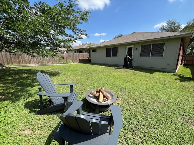 1032 Stacias Way, Pflugerville, TX 78660 - rear view of house with an outdoor fire pit