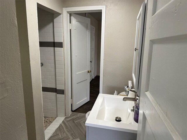 808 E 46th St Unit C, Austin, TX 78751 - bathroom featuring vanity and a textured wall