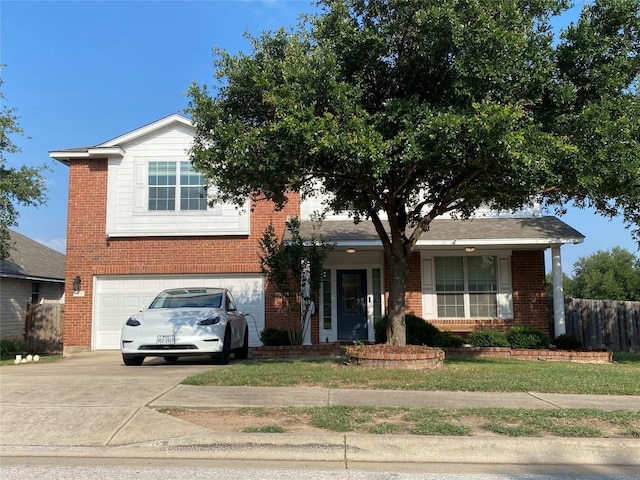 14501 Dreamtime Ln, Pflugerville, TX 78660 - view of front facade with a garage, brick siding, and driveway