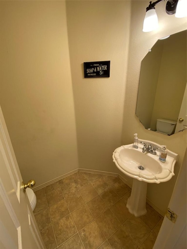 14501 Dreamtime Ln, Pflugerville, TX 78660 - half bathroom with baseboards and a sink