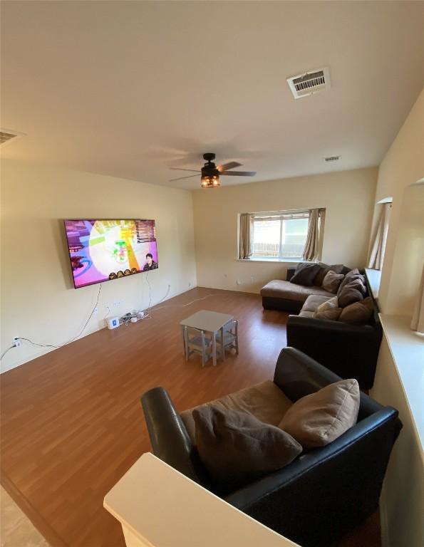 14501 Dreamtime Ln, Pflugerville, TX 78660 - living area featuring a ceiling fan and wood finished floors