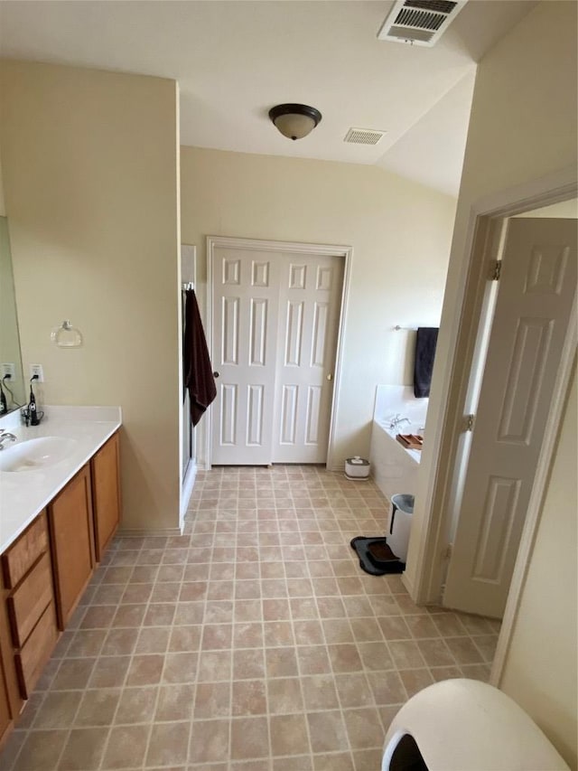 14501 Dreamtime Ln, Pflugerville, TX 78660 - full bathroom with a bath, vanity, vaulted ceiling, and a shower stall