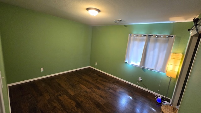 14501 Dreamtime Ln, Pflugerville, TX 78660 - unfurnished room featuring wood finished floors, a barn door, and baseboards
