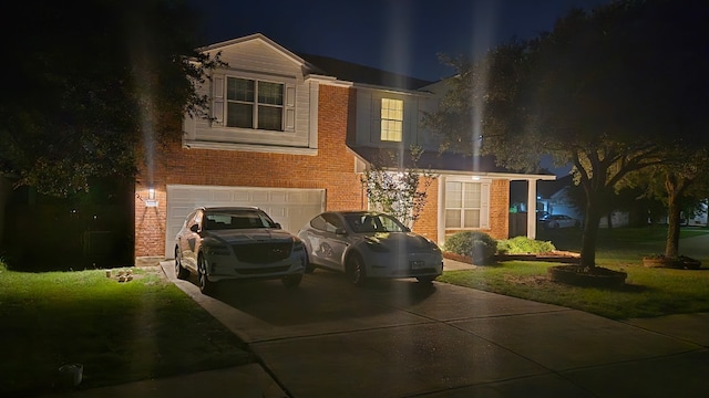 14501 Dreamtime Ln, Pflugerville, TX 78660 - traditional-style house with brick siding, an attached garage, driveway, and a yard