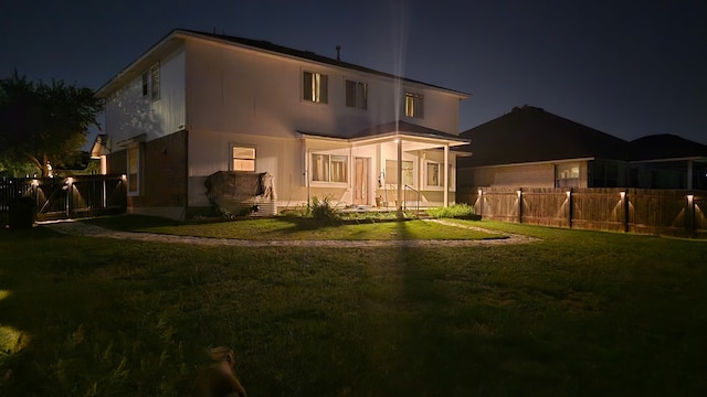 14501 Dreamtime Ln, Pflugerville, TX 78660 - back of house at twilight with an attached garage