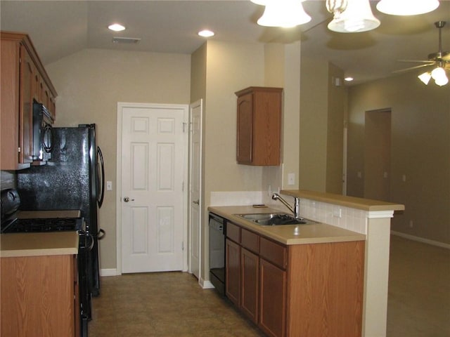 123 Bayliss St, Hutto, TX 78634 - kitchen with a sink, black appliances, ceiling fan, brown cabinets, and light countertops