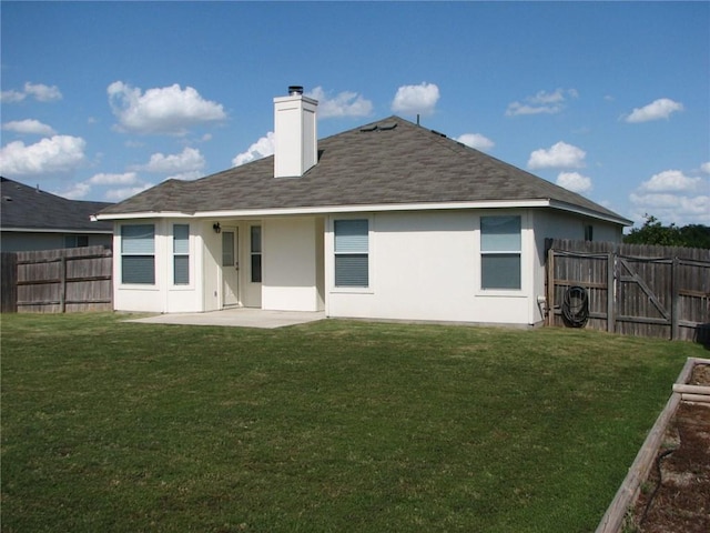 123 Bayliss St, Hutto, TX 78634 - rear view of house with a patio area, stucco siding, a chimney, and roof with shingles