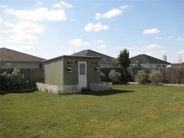 123 Bayliss St, Hutto, TX 78634 - view of yard with an outbuilding
