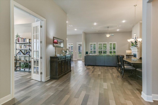 3221 Venezia Vw, Leander, TX 78641 - hall with wood finished floors, a chandelier, and recessed lighting