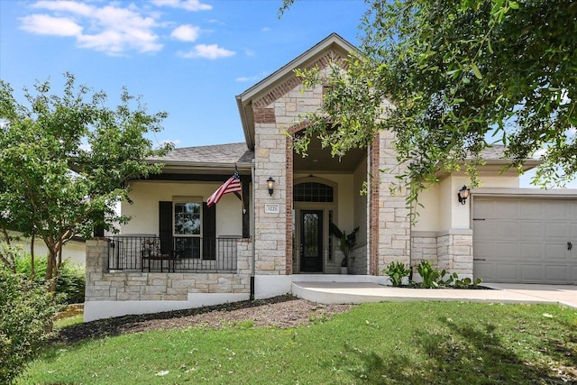 3221 Venezia Vw, Leander, TX 78641 - view of front of property featuring stone siding, stucco siding, covered porch, and a front lawn