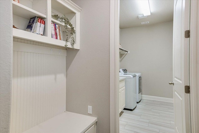 3221 Venezia Vw, Leander, TX 78641 - laundry area with washing machine and dryer and cabinet space