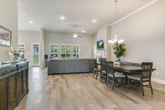 3221 Venezia Vw, Leander, TX 78641 - dining area featuring light wood-style floors, a chandelier, ceiling fan, and recessed lighting