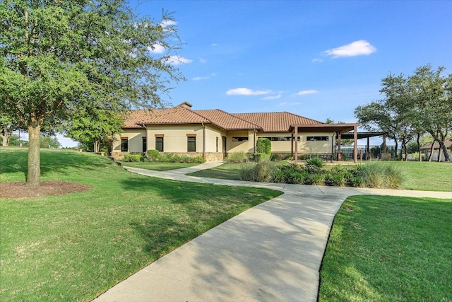 3221 Venezia Vw, Leander, TX 78641 - mediterranean / spanish-style home featuring a front yard, a tile roof, and stucco siding