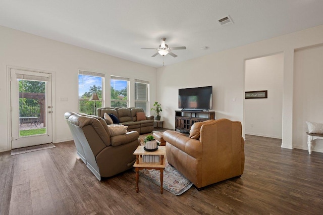 1437 Morning View Rd, Georgetown, TX 78628 - living room featuring dark wood-type flooring, a ceiling fan, and baseboards