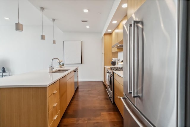 1322 E 12th St Unit 306, Austin, TX 78702 - kitchen with high quality appliances, modern cabinets, a sink, recessed lighting, and a kitchen island with sink