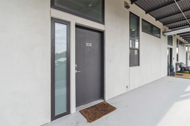 1322 E 12th St Unit 306, Austin, TX 78702 - view of exterior entry with stucco siding