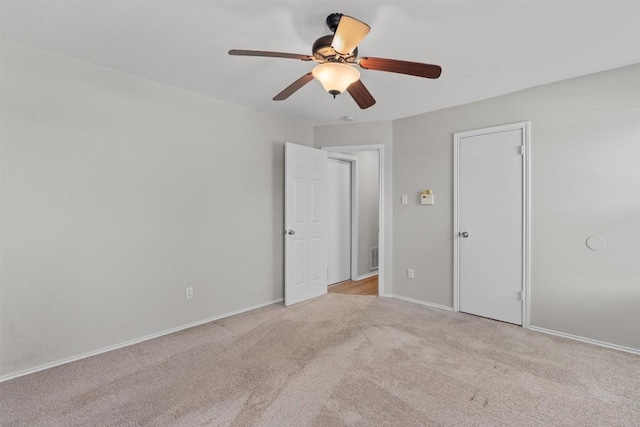 5902 Shreveport Dr, Austin, TX 78727 - unfurnished bedroom featuring carpet flooring, baseboards, and a ceiling fan