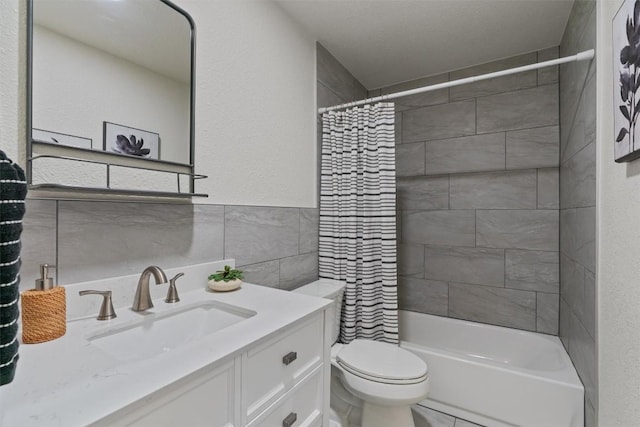 5902 Shreveport Dr, Austin, TX 78727 - full bathroom with tile walls, vanity, toilet, and shower / bath combo