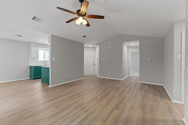 5902 Shreveport Dr, Austin, TX 78727 - unfurnished living room with a ceiling fan, light wood-style floors, lofted ceiling, and baseboards