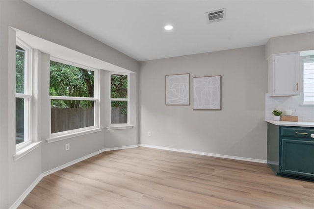 5902 Shreveport Dr, Austin, TX 78727 - unfurnished dining area with light wood finished floors, baseboards, and recessed lighting