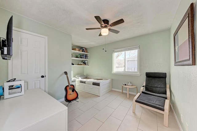 3310 Monument Dr, Round Rock, TX 78681 - office with ceiling fan, a textured ceiling, baseboards, and light tile patterned floors