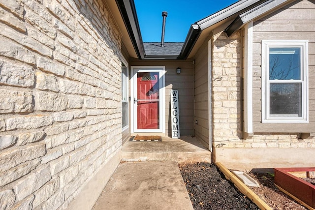 3310 Monument Dr, Round Rock, TX 78681 - property entrance featuring roof with shingles and stone siding