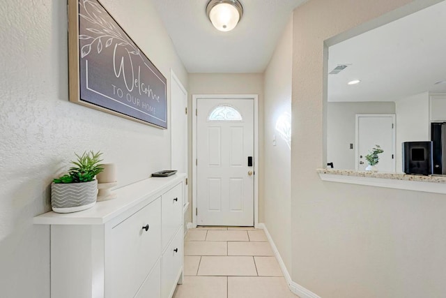 3310 Monument Dr, Round Rock, TX 78681 - doorway to outside featuring light tile patterned floors and baseboards