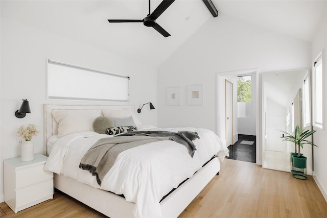 928 E 54th St, Austin, TX 78751 - bedroom with beamed ceiling, wood finished floors, high vaulted ceiling, and a ceiling fan