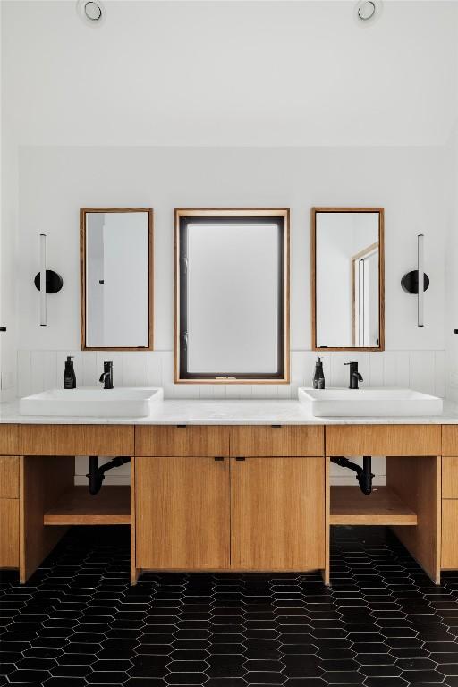 928 E 54th St, Austin, TX 78751 - bathroom with double vanity and a wainscoted wall
