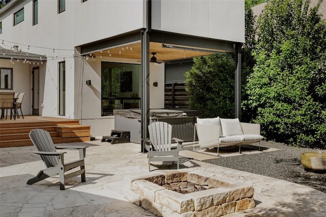 928 E 54th St, Austin, TX 78751 - view of patio with a hot tub, a fire pit, and a ceiling fan