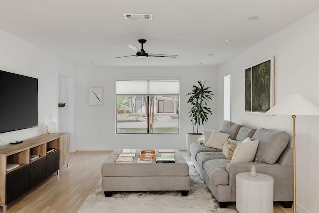 928 E 54th St, Austin, TX 78751 - living area featuring ceiling fan and light wood finished floors