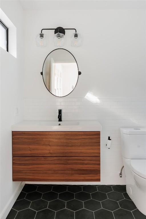 928 E 54th St, Austin, TX 78751 - half bath featuring vanity and tile patterned flooring