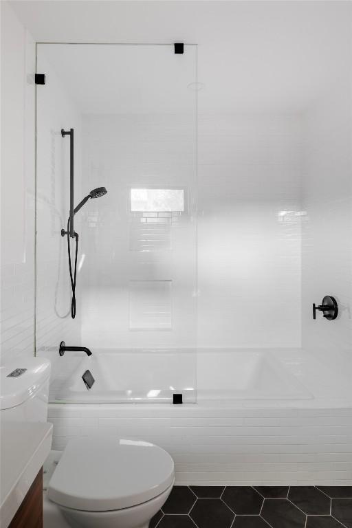 928 E 54th St, Austin, TX 78751 - full bath featuring shower / washtub combination, vanity, and tile patterned floors