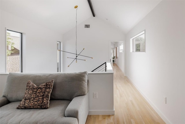 928 E 54th St, Austin, TX 78751 - living area with light wood-type flooring and a chandelier