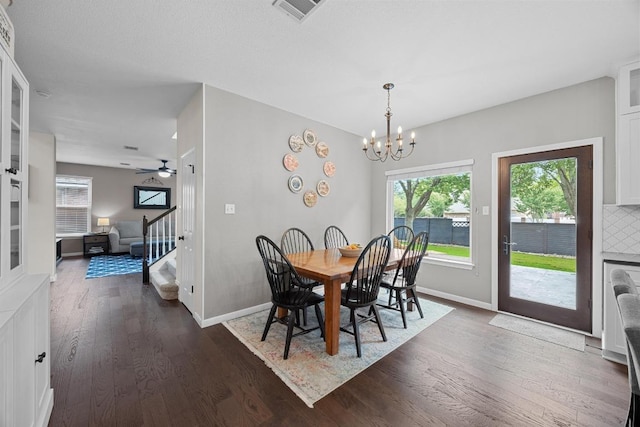 2003 Red Oak Cir, Round Rock, TX 78681 - dining space featuring dark wood-style flooring, stairway, baseboards, and a chandelier
