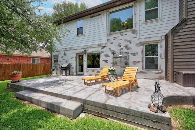 2003 Red Oak Cir, Round Rock, TX 78681 - rear view of house featuring a patio and central AC