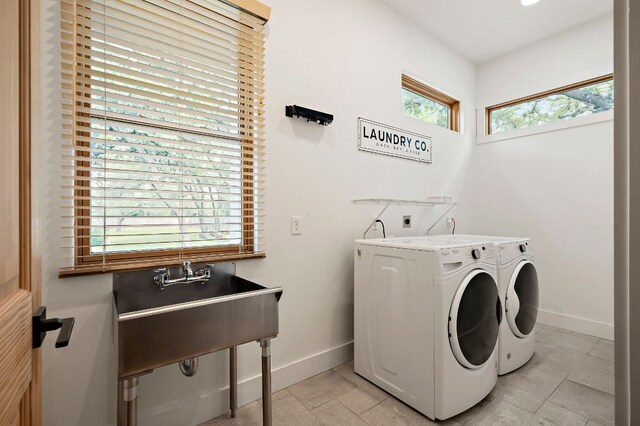 2819 Cross Rd, San Marcos, TX 78666 - washroom featuring baseboards, independent washer and dryer, and stone tile floors