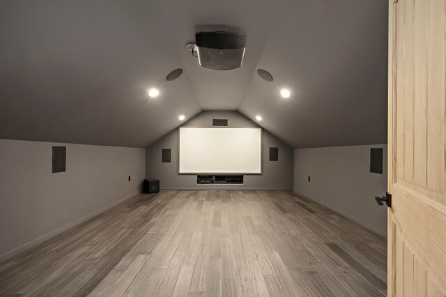 2819 Cross Rd, San Marcos, TX 78666 - cinema featuring wood finished floors, baseboards, and vaulted ceiling