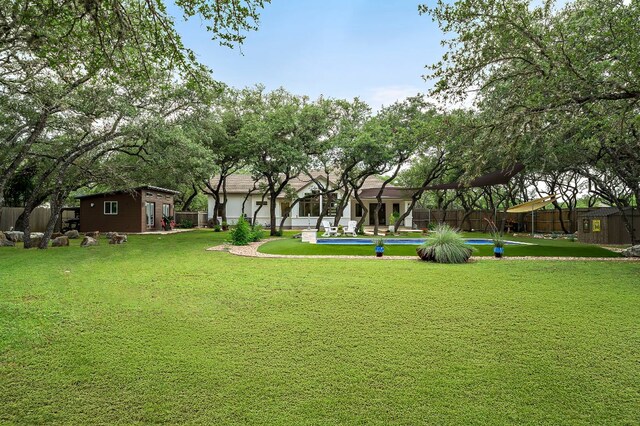 2819 Cross Rd, San Marcos, TX 78666 - view of home's community featuring a pool and an outdoor structure
