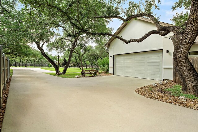2819 Cross Rd, San Marcos, TX 78666 - view of home's exterior featuring driveway and stucco siding