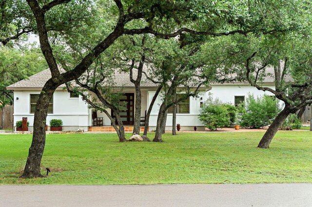 2819 Cross Rd, San Marcos, TX 78666 - view of front facade featuring stucco siding and a front lawn