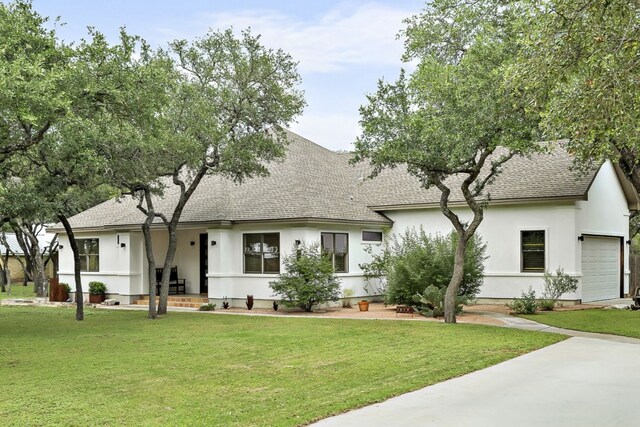 2819 Cross Rd, San Marcos, TX 78666 - view of front of property featuring a shingled roof, a garage, and a front lawn