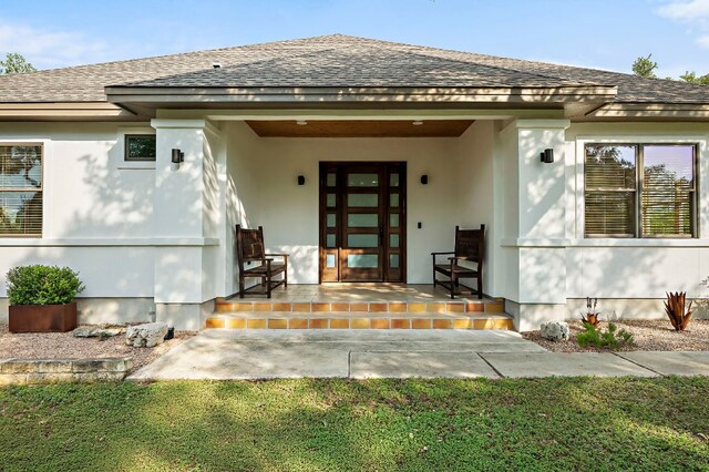 2819 Cross Rd, San Marcos, TX 78666 - doorway to property with a shingled roof, a porch, and stucco siding