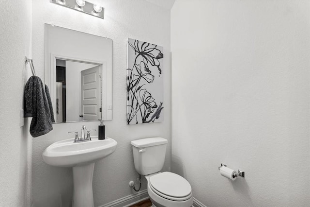8103 Mandela Bnd, Austin, TX 78744 - bathroom featuring toilet and baseboards