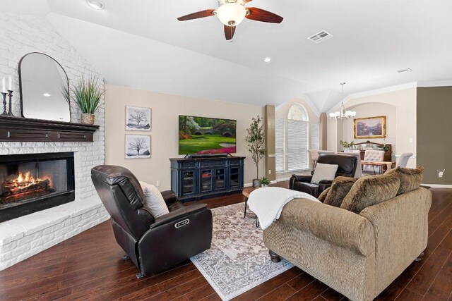3712 Cerulean Way, Round Rock, TX 78681 - living room with vaulted ceiling, a chandelier, a ceiling fan, wood finished floors, and a brick fireplace