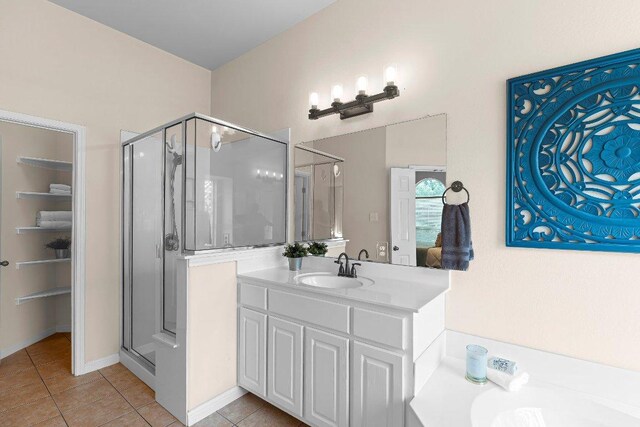 3712 Cerulean Way, Round Rock, TX 78681 - bathroom with a shower stall, tile patterned flooring, vanity, and a tub to relax in