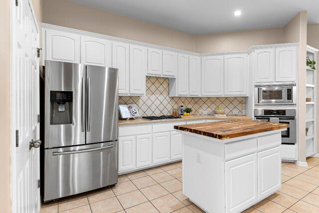 3712 Cerulean Way, Round Rock, TX 78681 - kitchen featuring stainless steel appliances, butcher block countertops, light tile patterned flooring, white cabinetry, and recessed lighting