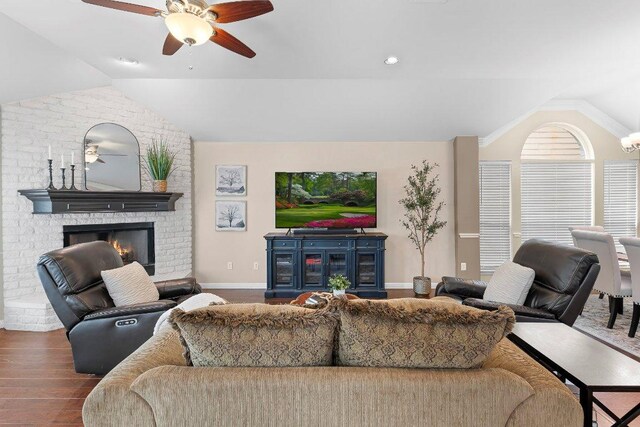 3712 Cerulean Way, Round Rock, TX 78681 - living area with lofted ceiling, a fireplace, ceiling fan, and wood finished floors