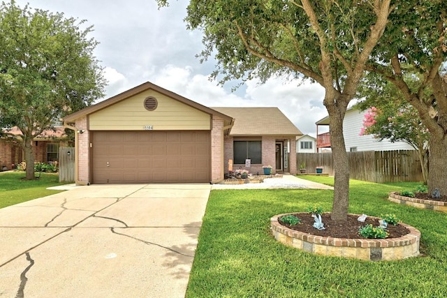 5504 Alomar Cv, Del Valle, TX 78617 - ranch-style home with brick siding, an attached garage, and driveway